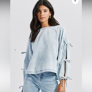 Something navy tie sleeve denim top. It’s a M fits more like a S worn once